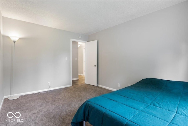 601 Woodbine, Terre Haute, IN 47803 - bedroom featuring carpet flooring, baseboards, and a textured ceiling