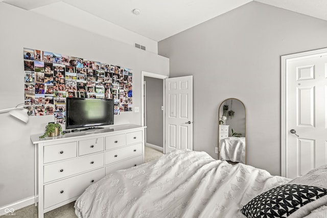 10697 Woodmont Ln, Fishers, IN 46037 - bedroom featuring vaulted ceiling, light colored carpet, and baseboards