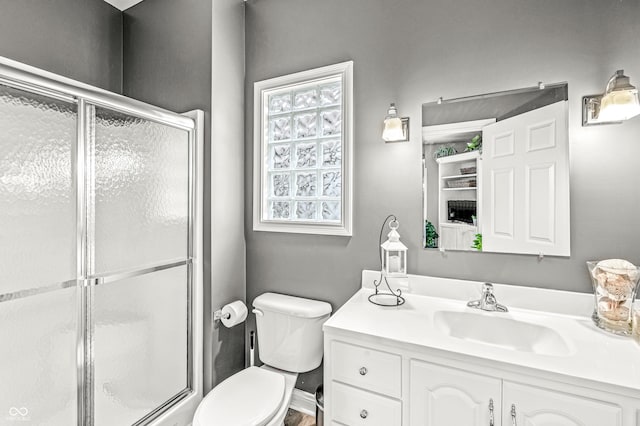 10697 Woodmont Ln, Fishers, IN 46037 - full bath featuring vanity, toilet, and a shower with door