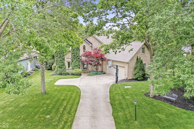 10697 Woodmont Ln, Fishers, IN 46037 - view of front of house with a front yard, a shingled roof, driveway, and brick siding