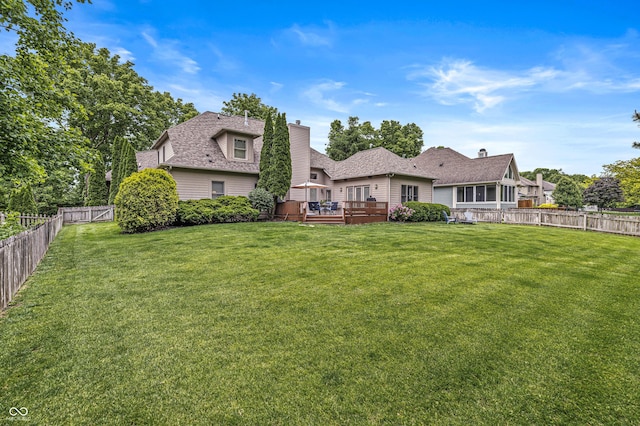 10697 Woodmont Ln, Fishers, IN 46037 - rear view of property with a deck and a chimney