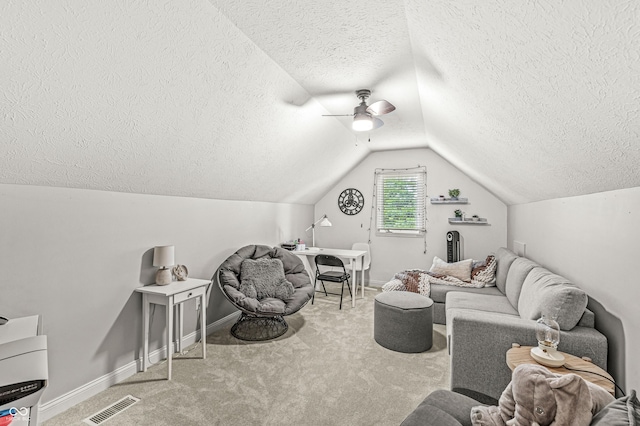 10697 Woodmont Ln, Fishers, IN 46037 - living room with a textured ceiling, carpet flooring, vaulted ceiling, ceiling fan, and baseboards