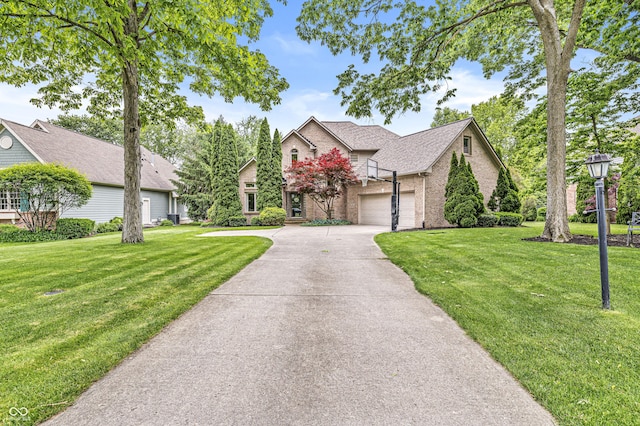 10697 Woodmont Ln, Fishers, IN 46037 - view of front of home with brick siding, concrete driveway, a front lawn, and roof with shingles