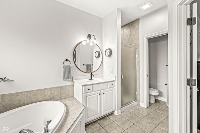 10697 Woodmont Ln, Fishers, IN 46037 - full bathroom featuring tile patterned flooring, vanity, a garden tub, toilet, and a stall shower