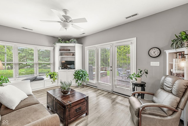 10697 Woodmont Ln, Fishers, IN 46037 - living room with plenty of natural light, ceiling fan, and light wood-style floors