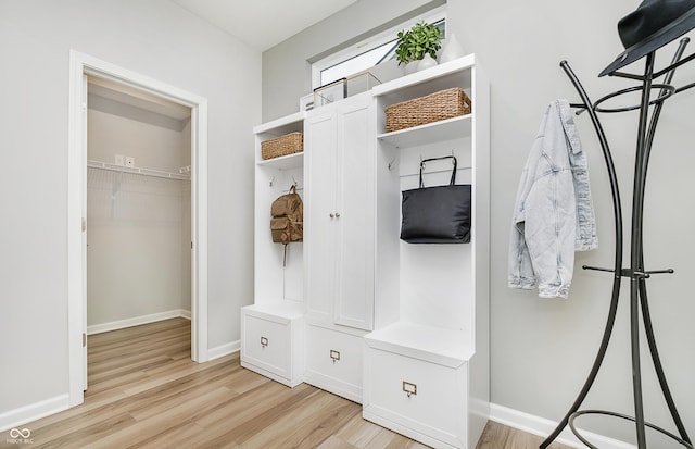 6849 Seabiscuit Rd, Whitestown, IN 46075 - mudroom with light wood finished floors and baseboards