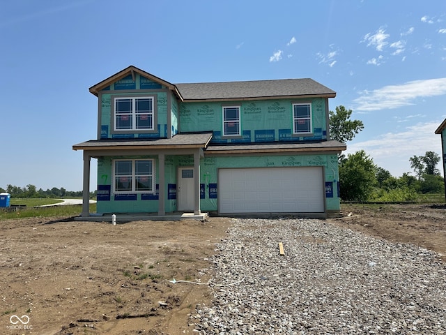 71 Benfield Dr, Whiteland, IN 46184 - property under construction with covered porch, driveway, and an attached garage