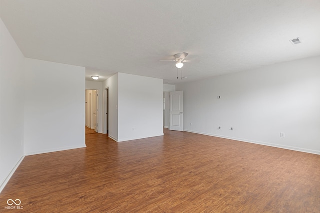 11531 Short Iron Ln, Indianapolis, IN 46235 - empty room with ceiling fan, wood finished floors, and baseboards