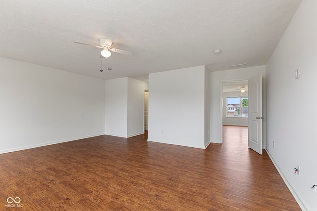 11531 Short Iron Ln, Indianapolis, IN 46235 - unfurnished room featuring a ceiling fan, dark wood-type flooring, and baseboards