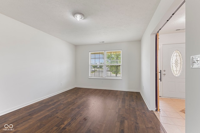 11531 Short Iron Ln, Indianapolis, IN 46235 - entryway with wood-type flooring, baseboards, and a textured ceiling