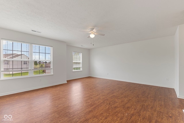 11531 Short Iron Ln, Indianapolis, IN 46235 - spare room featuring a ceiling fan, wood finished floors, baseboards, and a textured ceiling