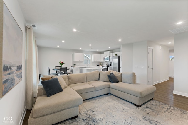 7051 E Bean Blossom Dr, Camby, IN 46113 - living room with recessed lighting, wood finished floors, and baseboards