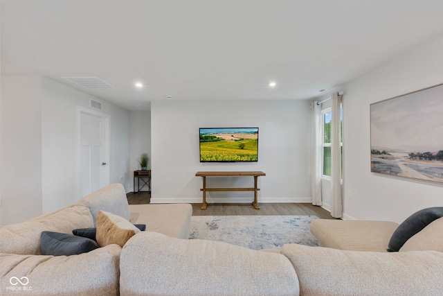 7051 E Bean Blossom Dr, Camby, IN 46113 - living area with wood finished floors, recessed lighting, and baseboards