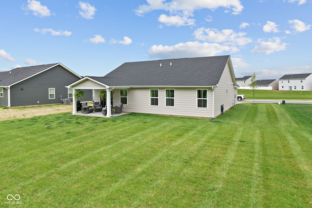 7051 E Bean Blossom Dr, Camby, IN 46113 - rear view of property featuring a patio, a yard, and roof with shingles