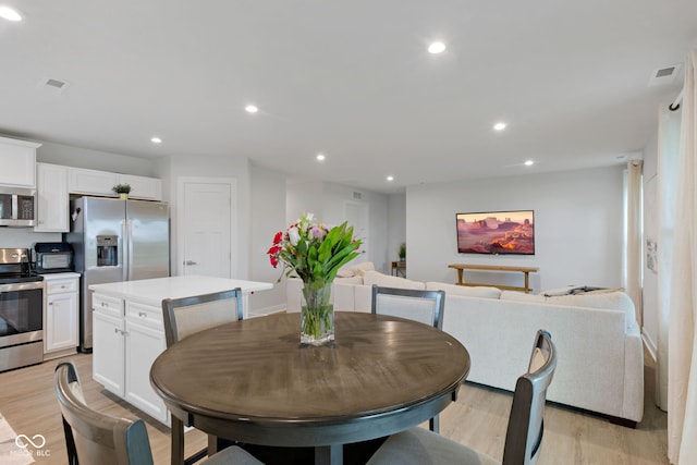 7051 E Bean Blossom Dr, Camby, IN 46113 - dining space with light wood-style flooring and recessed lighting