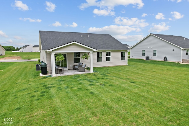 7051 E Bean Blossom Dr, Camby, IN 46113 - rear view of property featuring outdoor lounge area, a patio area, a yard, and roof with shingles