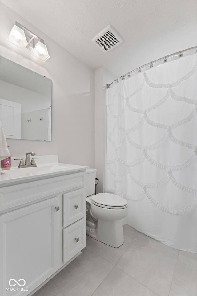 7051 E Bean Blossom Dr, Camby, IN 46113 - bathroom featuring toilet, vanity, tile patterned flooring, a textured ceiling, and curtained shower