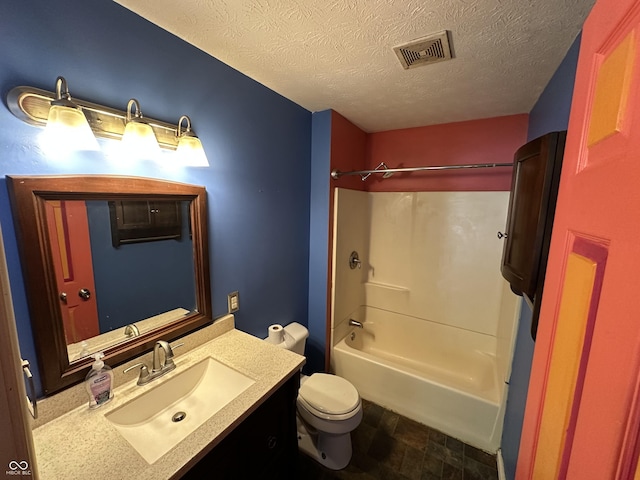 2133 10th St, Columbus, IN 47201 - bathroom with vanity, toilet, shower / tub combination, and a textured ceiling