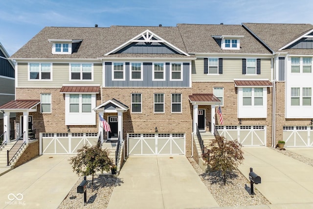 16072 Barringer Ct, Westfield, IN 46074 - townhome / multi-family property featuring driveway, a garage, and brick siding