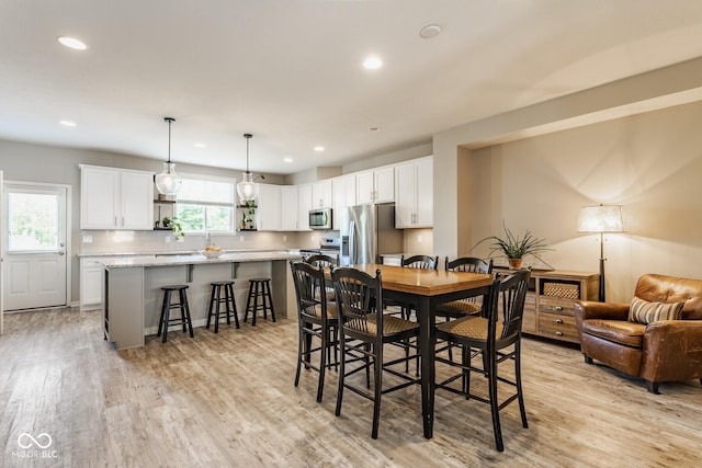 16072 Barringer Ct, Westfield, IN 46074 - dining space with light wood-type flooring and recessed lighting