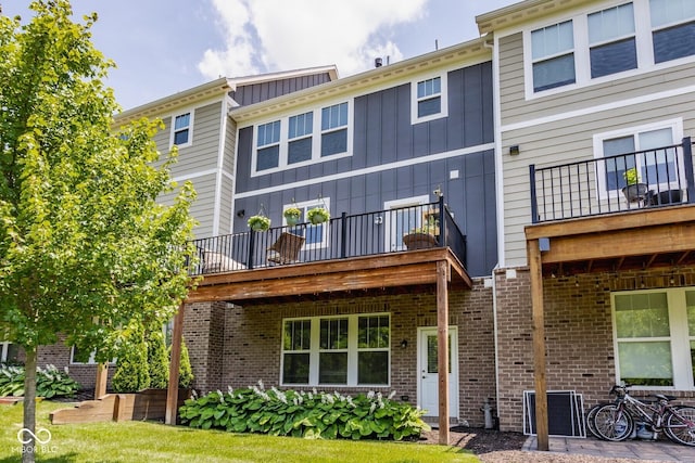 16072 Barringer Ct, Westfield, IN 46074 - rear view of house with a balcony, board and batten siding, and brick siding