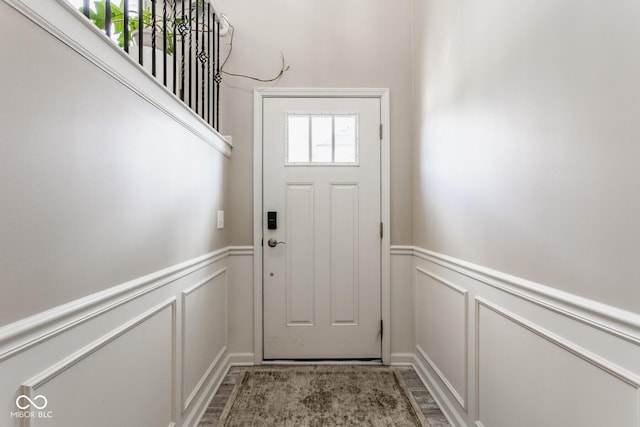 16072 Barringer Ct, Westfield, IN 46074 - doorway with a decorative wall, a wainscoted wall, and light wood finished floors