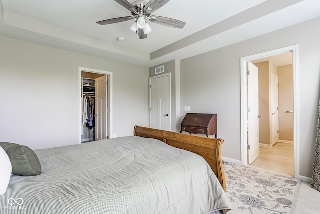 16072 Barringer Ct, Westfield, IN 46074 - bedroom with a spacious closet, a closet, ceiling fan, and light tile patterned floors