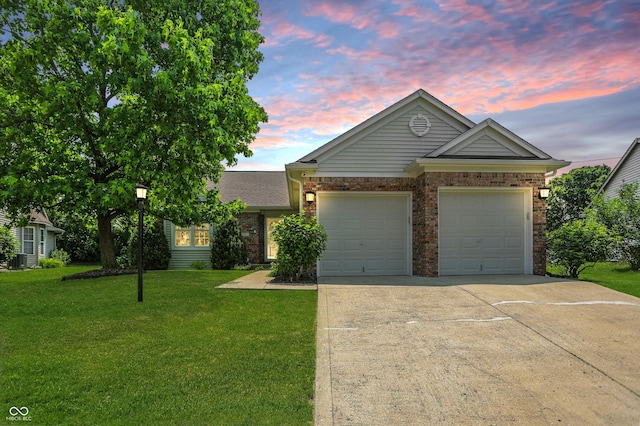 863 Lionshead Ln, Greenwood, IN 46143 - ranch-style house with concrete driveway, a lawn, an attached garage, and brick siding