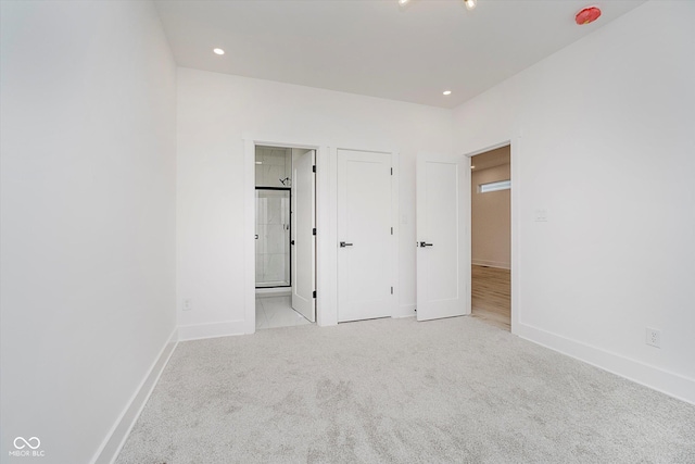 2909 E Michigan St, Indianapolis, IN 46201 - unfurnished bedroom featuring baseboards, carpet, connected bathroom, and recessed lighting