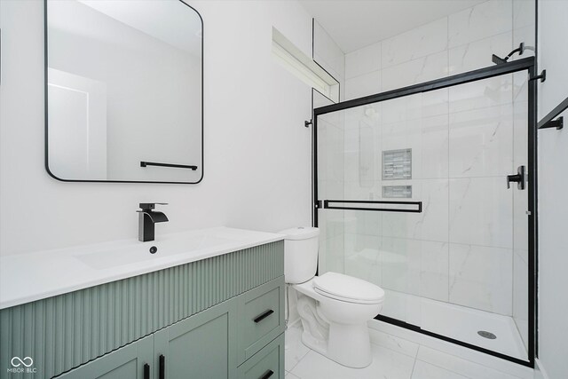 2909 E Michigan St, Indianapolis, IN 46201 - bathroom featuring marble look tiles, a stall shower, vanity, and toilet