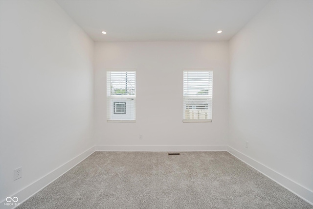 2909 E Michigan St, Indianapolis, IN 46201 - carpeted spare room featuring plenty of natural light, baseboards, and recessed lighting
