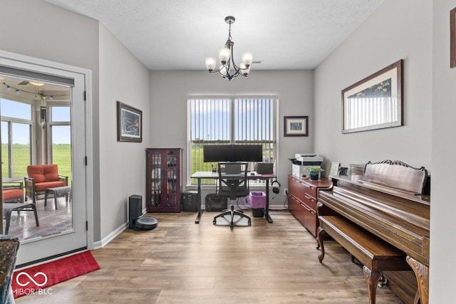 104 Perlican Dr, Cicero, IN 46034 - home office featuring a chandelier, wood finished floors, healthy amount of natural light, and baseboards