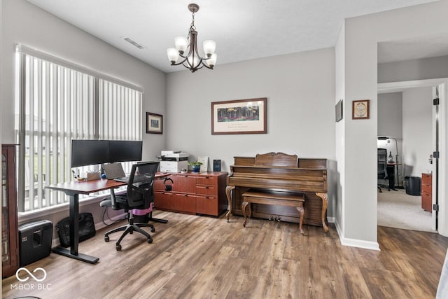 104 Perlican Dr, Cicero, IN 46034 - home office featuring wood finished floors, a chandelier, and baseboards