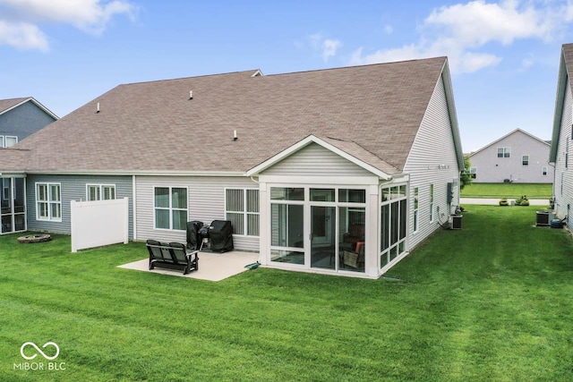 104 Perlican Dr, Cicero, IN 46034 - rear view of house featuring a shingled roof, a patio, and a yard