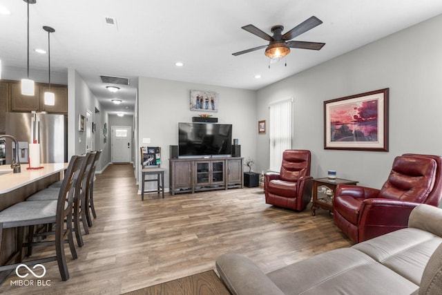 104 Perlican Dr, Cicero, IN 46034 - living area featuring ceiling fan, light wood-style floors, and recessed lighting