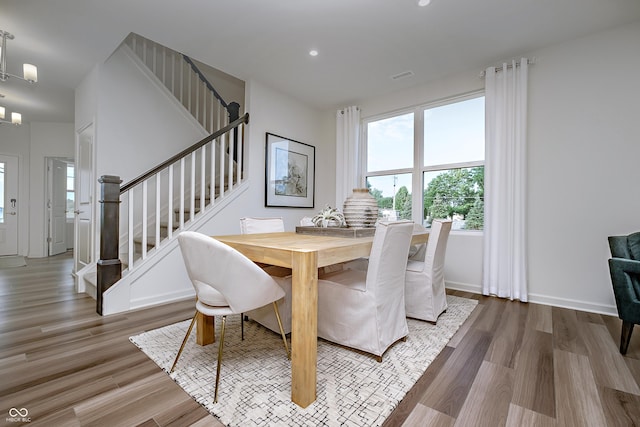 6841 Seabiscuit Rd, Whitestown, IN 46075 - dining area featuring stairway, wood finished floors, recessed lighting, and baseboards