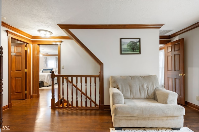 2708 N 400 E, Greenfield, IN 46140 - sitting room with ornamental molding, an upstairs landing, a textured ceiling, wood finished floors, and baseboards