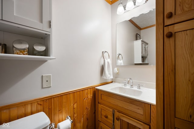 2708 N 400 E, Greenfield, IN 46140 - half bathroom with ornamental molding, wainscoting, vanity, toilet, and wooden walls