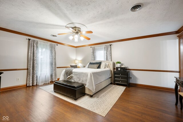 2708 N 400 E, Greenfield, IN 46140 - bedroom featuring wood finished floors, crown molding, baseboards, a ceiling fan, and a textured ceiling