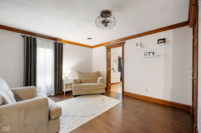 2708 N 400 E, Greenfield, IN 46140 - living room featuring ornamental molding, a textured ceiling, dark wood-type flooring, and baseboards