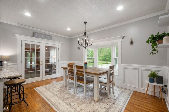 2708 N 400 E, Greenfield, IN 46140 - dining space featuring french doors, a chandelier, light wood-type flooring, wainscoting, and recessed lighting