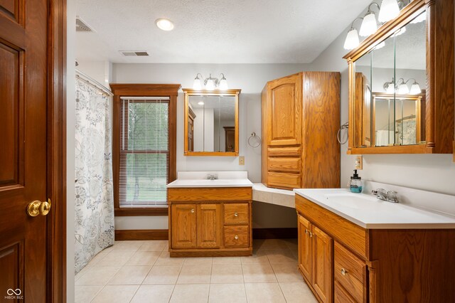 2708 N 400 E, Greenfield, IN 46140 - full bath featuring two vanities, tile patterned flooring, and baseboards