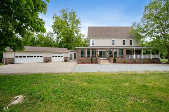 2708 N 400 E, Greenfield, IN 46140 - view of front of home featuring brick siding, a front lawn, and a garage