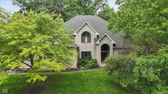 7138 Nile Ridge Ct, Indianapolis, IN 46236 - view of front of property with roof with shingles, a front yard, and brick siding