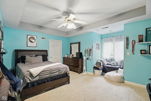 7138 Nile Ridge Ct, Indianapolis, IN 46236 - bedroom featuring carpet floors, a tray ceiling, baseboards, a ceiling fan, and a textured ceiling