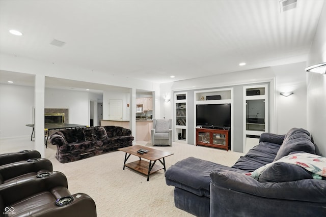 7138 Nile Ridge Ct, Indianapolis, IN 46236 - living area with light carpet, a fireplace, built in features, and recessed lighting