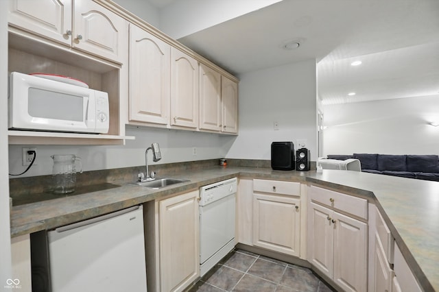 7138 Nile Ridge Ct, Indianapolis, IN 46236 - kitchen featuring white appliances, a sink, dark tile patterned floors, recessed lighting, and open floor plan