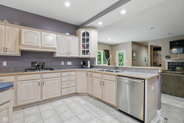 7138 Nile Ridge Ct, Indianapolis, IN 46236 - kitchen with stainless steel dishwasher, a sink, a peninsula, open floor plan, and glass insert cabinets