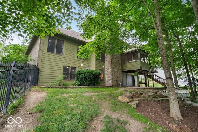6363 Harmonridge Ct, Indianapolis, IN 46278 - back of property with a sunroom and stairs