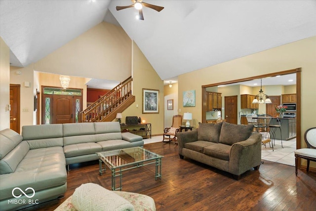 6363 Harmonridge Ct, Indianapolis, IN 46278 - living room with a chandelier, high vaulted ceiling, stairway, a ceiling fan, and hardwood / wood-style floors